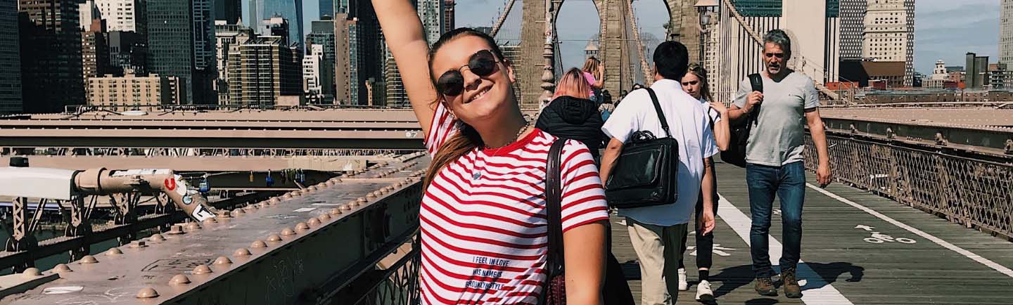 Happy exchange student on Brooklyn Bridge
